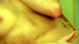 This Midwestern college coed in lingerie and fishnets stockingly fingers her shaved pussy with dildo on bed. She gapes asshole for anal toy play as mother-in-law watches.