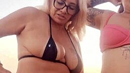 Blonde amateur chats dirty on the beach with her naughty latina friend before they deflower the young virgin guy they meet