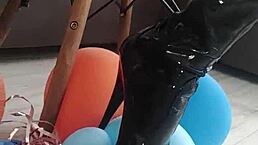 Veve does balloon popping in latex stockings with a sharp tool