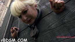 Chick chained in shackles for hardcore BDSM castigation torment.