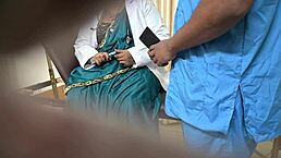 indian doctor enjoys lighthearted moments with patient in hospital clinic