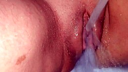 she's showing off her fat shaved pussy in the shower for joi enjoyment