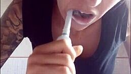 Brushing teeth matters a lot. Chantal enjoys filling her mouth with toothpaste in this homemade close-up.