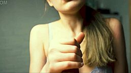 a beauty with red lips gives her boyfriend a close-up handjob until he reaches intense pleasure