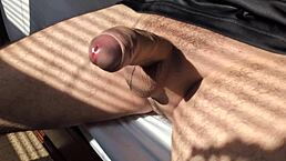 uh, just me masturbating in the bedroom summertime with my big cock close-up on the bed...